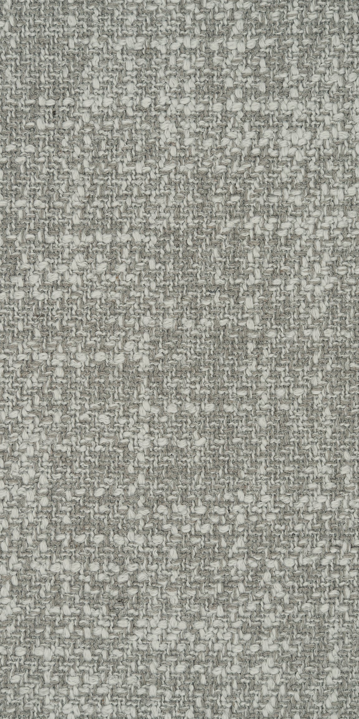 Deze licht grijze hoekbank stof van Leotex. Ook wel tweed dankzij de textuur van de verschillende kleuren aan geweven draden. Een bouclé interieurstof idee dankzij de textuur van deze stof. De weefmethode zorgt voor een geweven kwaliteit stof.