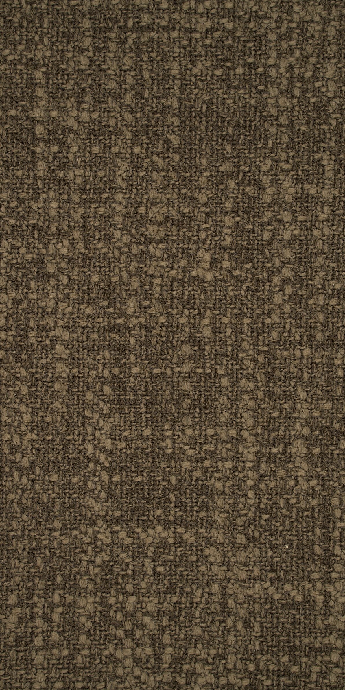 Geweven meubelstof in het donkerbruin met een voelbare, onregelmatige textuur. De kleur is een mix van donkerbruine en beige aardetinten. Slijtvaste stof voor bekleding van meubelen.